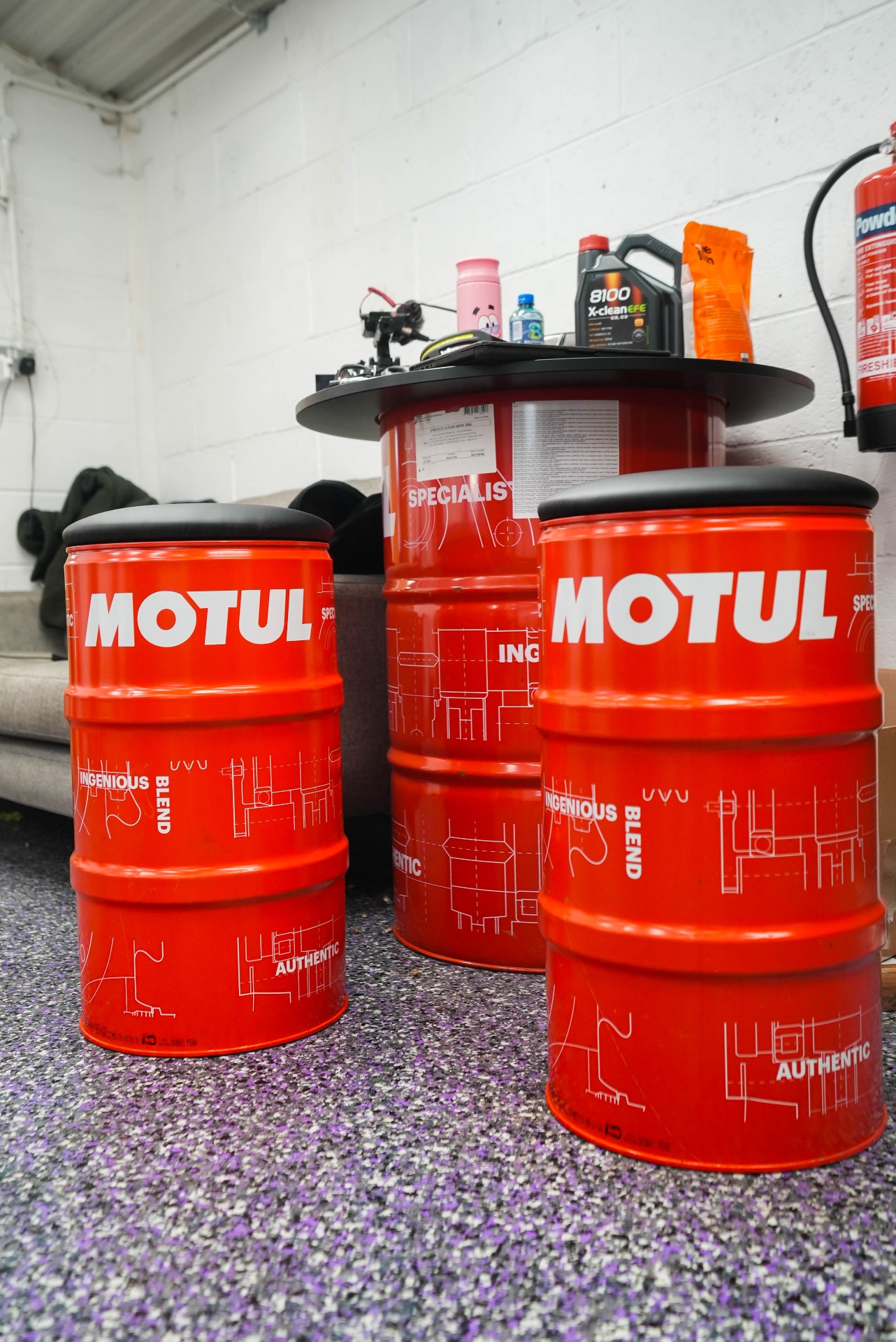 flake resin floor in professional Motul-branded workshop environment